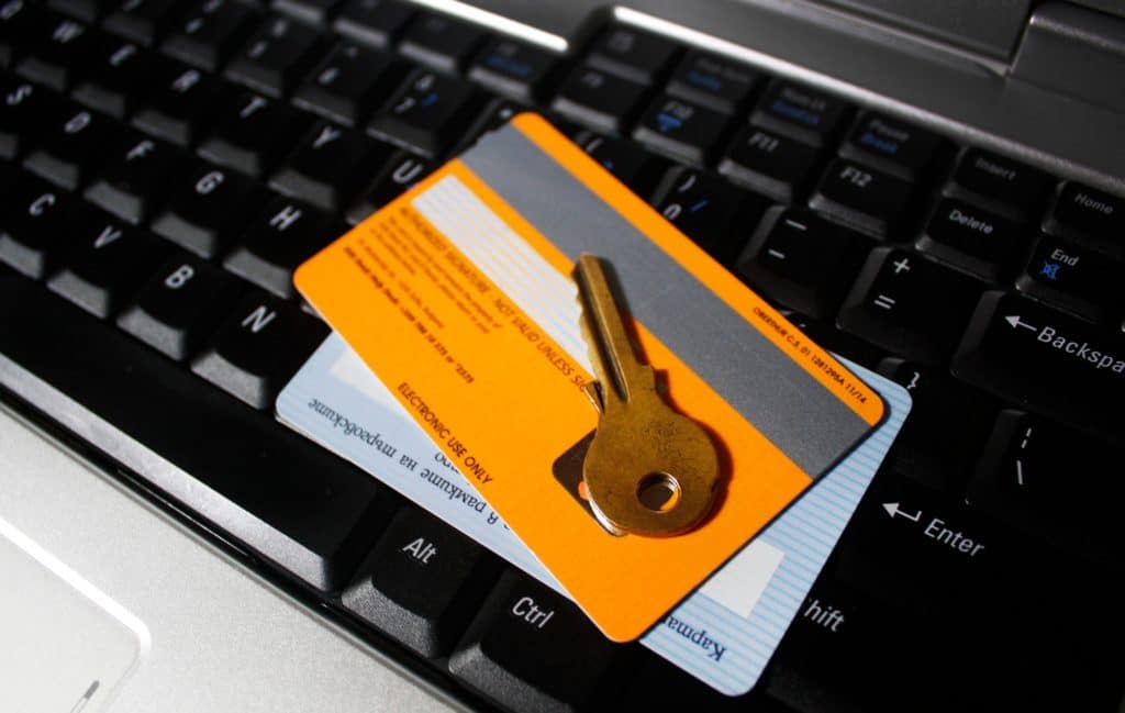 Internet security, bank cards and a key on keyboard